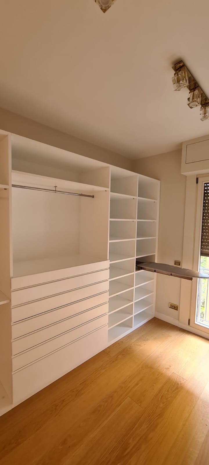 Open dressing room with pull-out ironing station