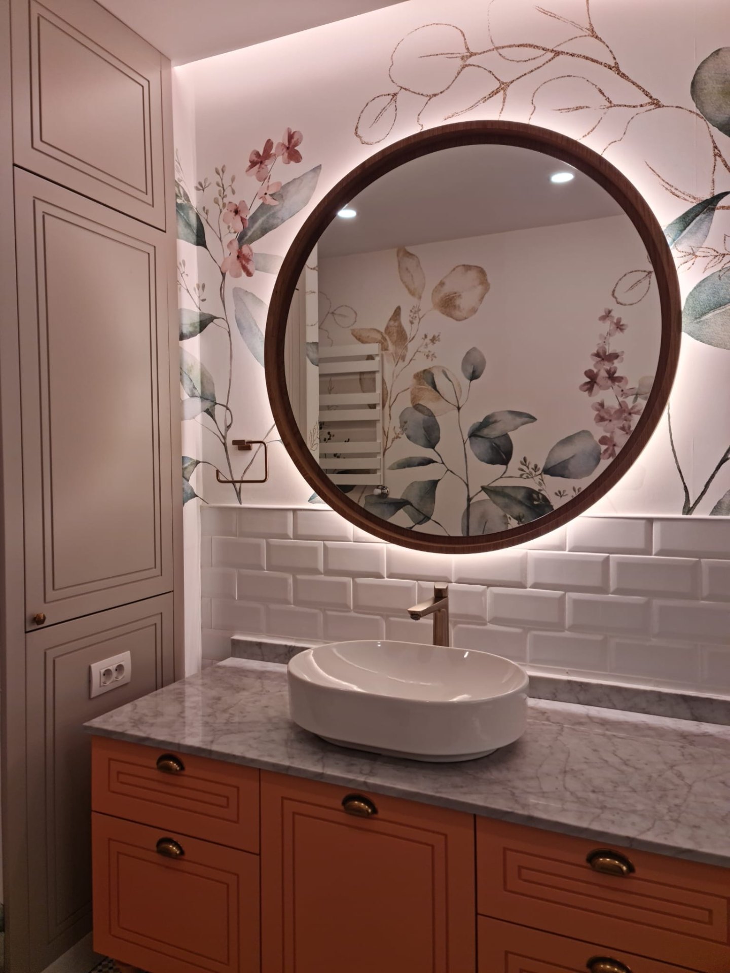 Walnut framed backlit round mirror over Carrara marble top with terracotta shaker vanity