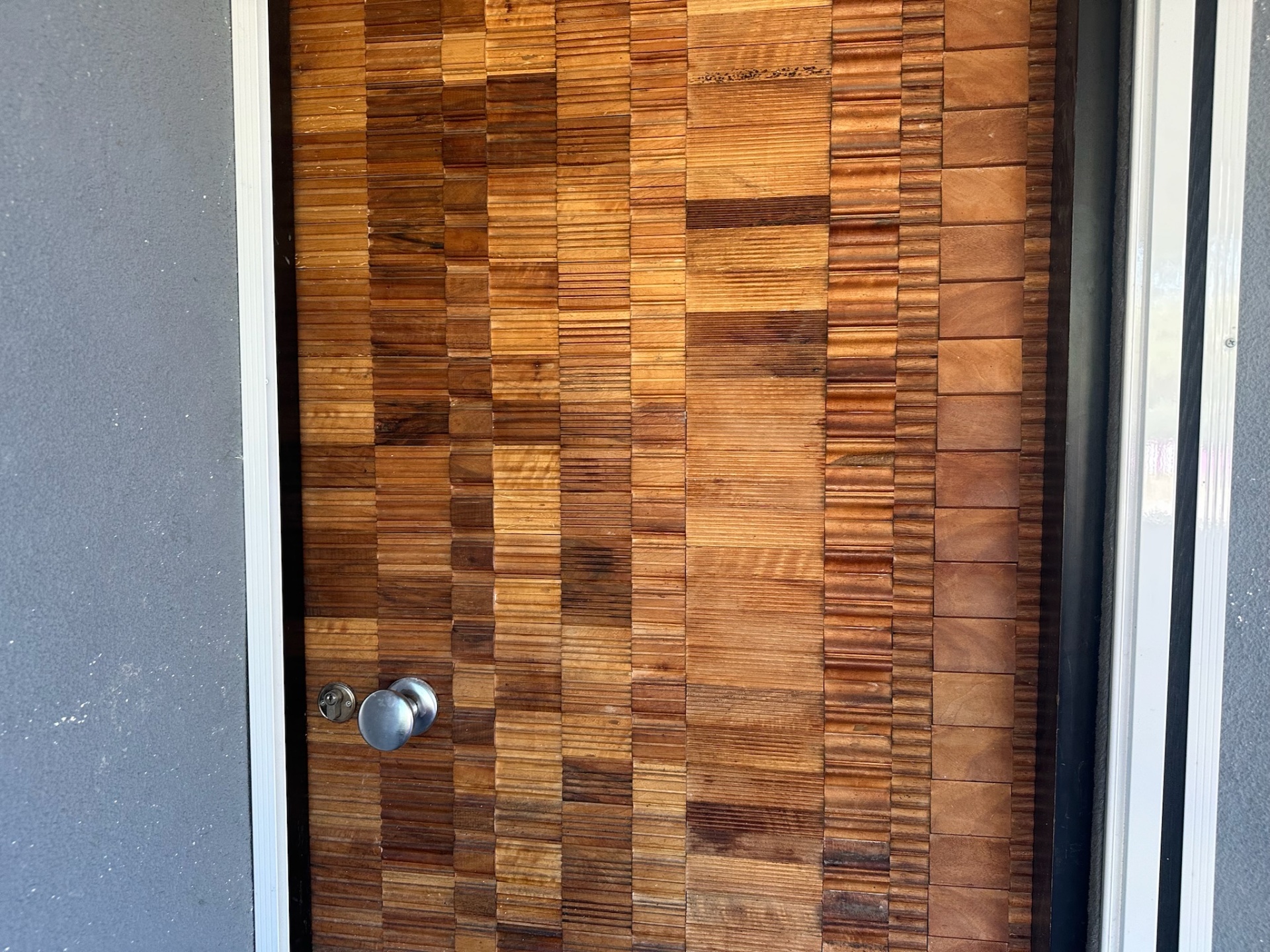 End-grain timber mosaic entrance door — artisan commission