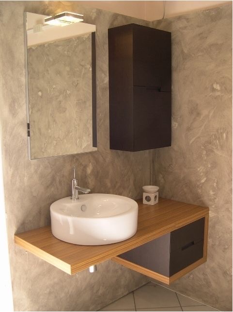 Floating zebrano vanity with round basin and Venetian plaster finish