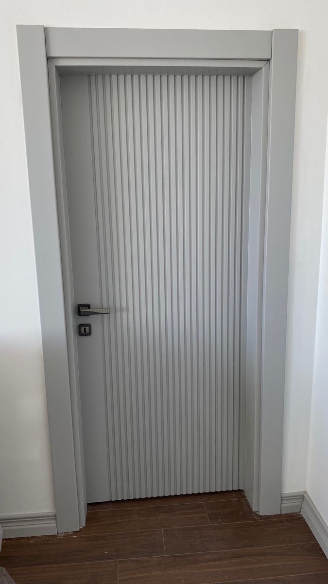 Fluted lacquer interior door in soft dove grey