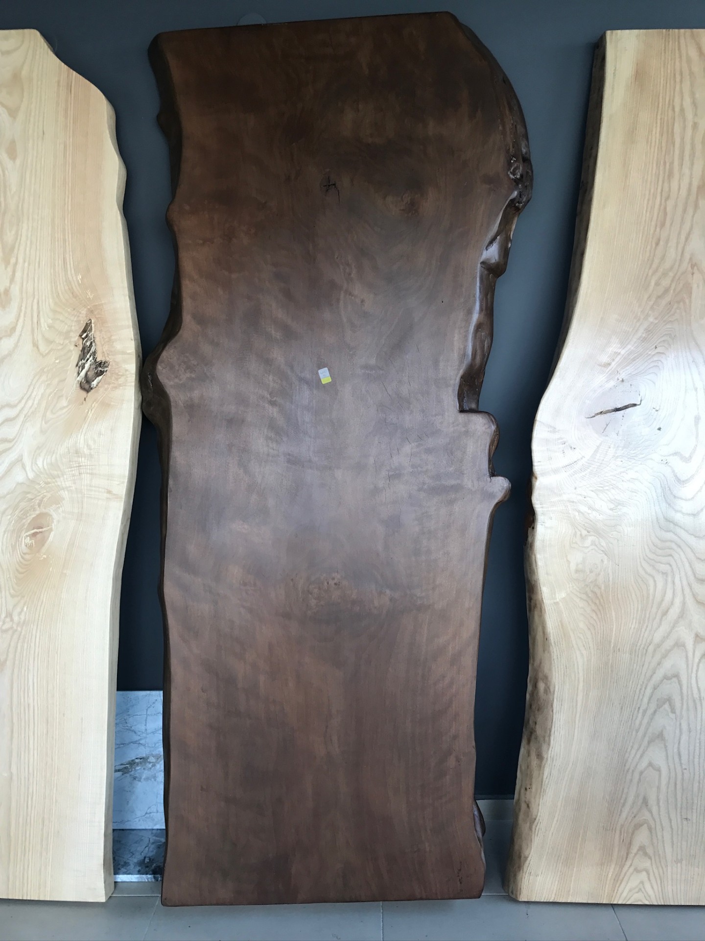 Selection of walnut and ash slabs prepared for bespoke commissions