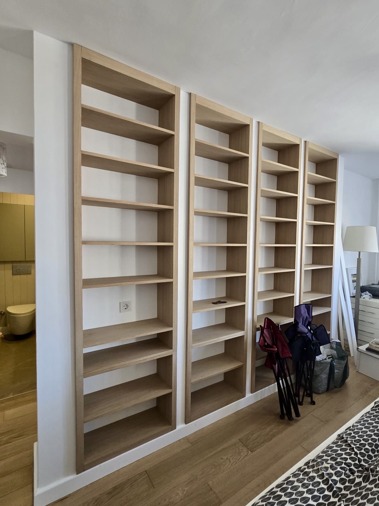 Four-bay oak library wall — floor-to-ceiling built-in