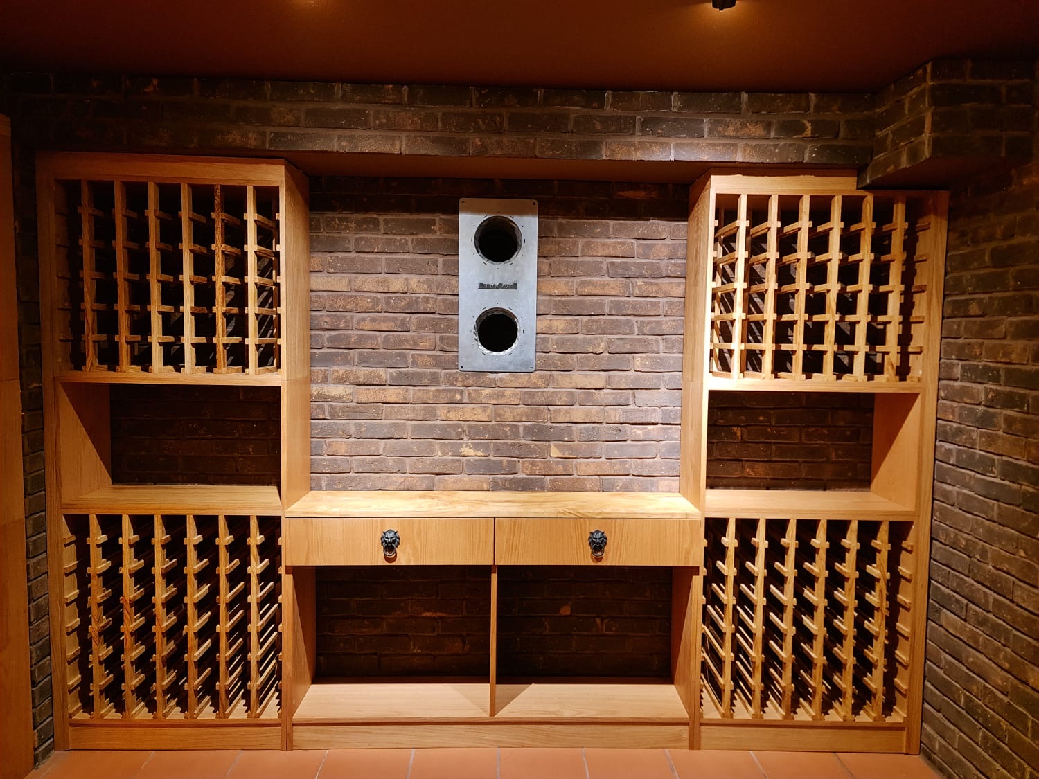 Symmetrical bottle bays around an integrated climate unit.